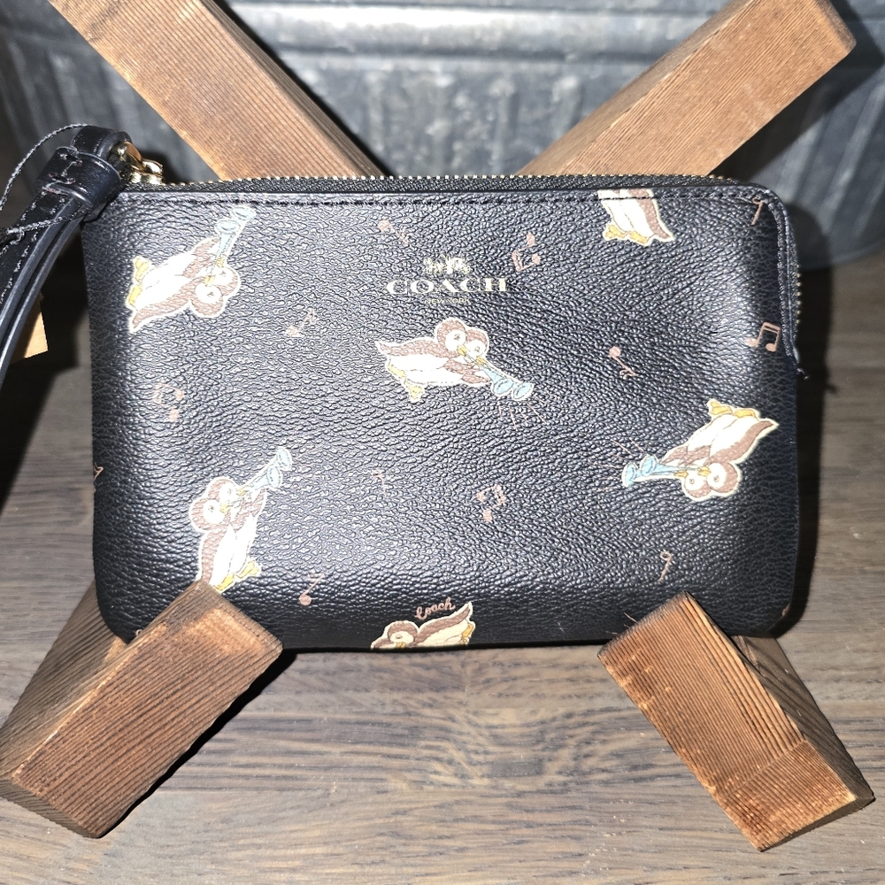 Authentic COACH Signature Coated leather penguin print  zip top wristlet